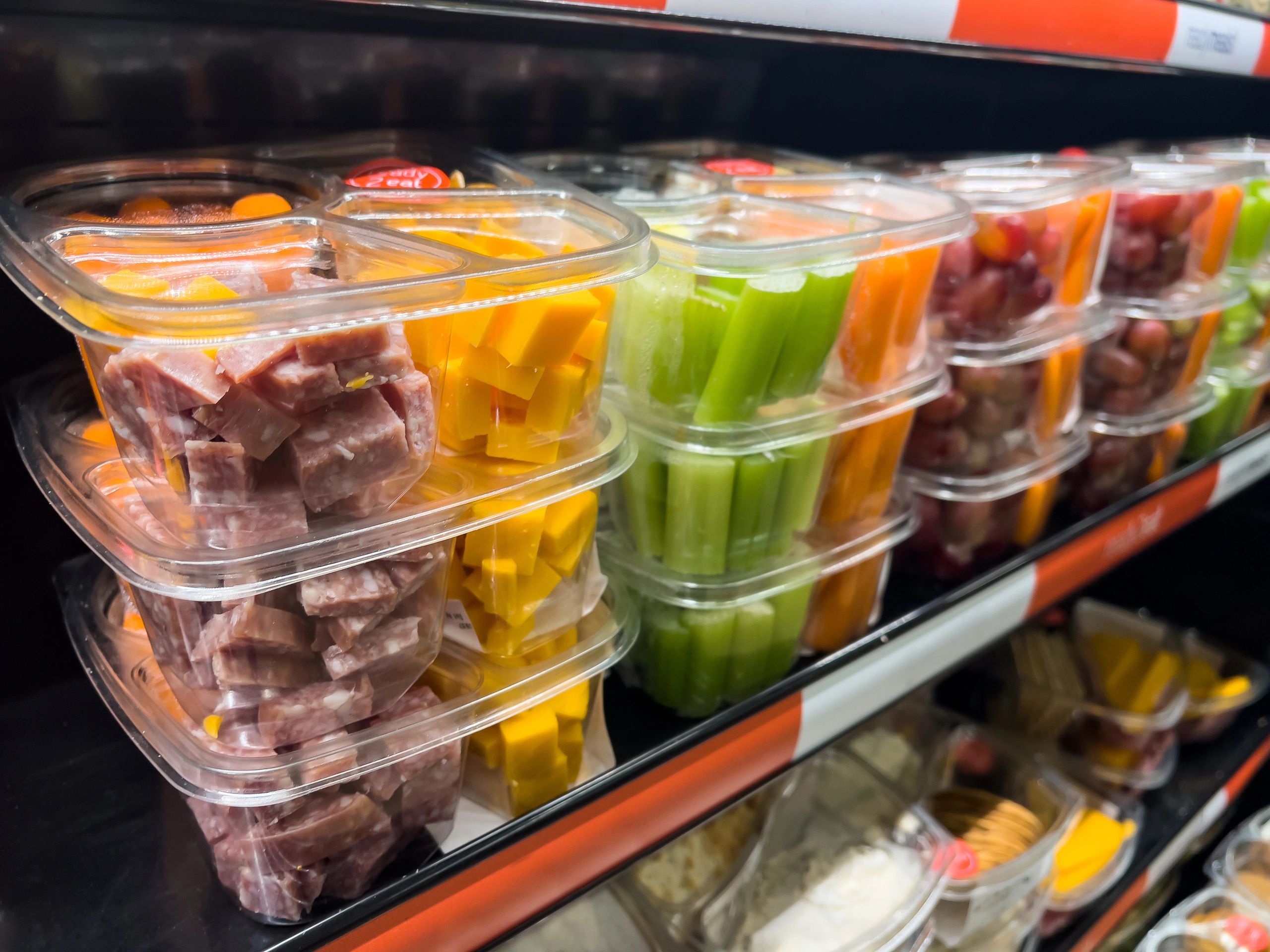Prepared grab-and-go meals displayed in a refrigerated market shelf
